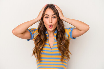 Fototapeta premium Young caucasian woman isolated on white background being shocked, she has remembered important meeting.