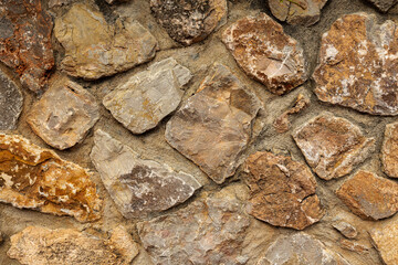 Background of orange stone wall texture horizontal photo