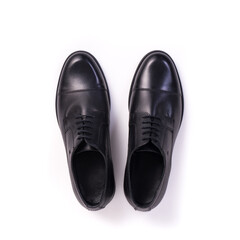 top view pair of men's elegant black leather shoes isolated on white background
