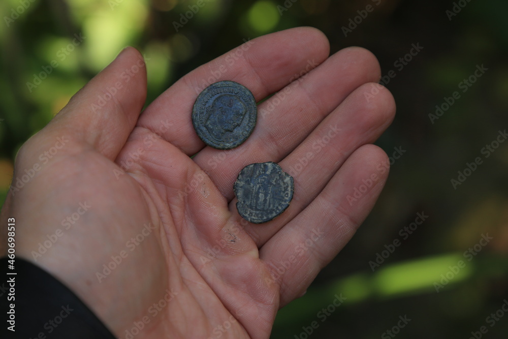 Wall mural ancient roman coin in hand