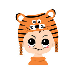 Avatar of boy with emotions of suspicious, displeased face in tiger hat. Cute kid with annoyed expression in carnival costume for New Year, Christmas and holiday. Head of adorable child