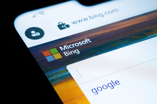 Microsoft BING search engine website with typed GOOGLE word seen on smartphone screen. Concept for competition. Selective focus. Stafford, United Kingdom, October 3, 2021.