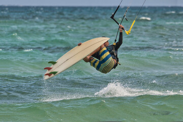 Wind surfer taking risk while surfing in the seas of the Caribbean
