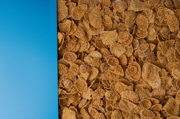 The texture of the corn flakes breakfast taken from the top and the blue area for the text