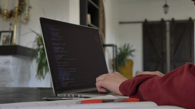 Woman developer working with computer at home office, closeup view on hands