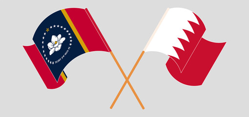 Crossed and waving flags of The State of Mississippi and Bahrain