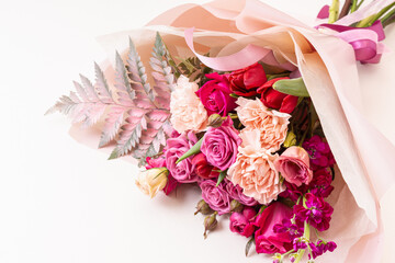 Flower shop. Beautiful bouquet in pink-red shades