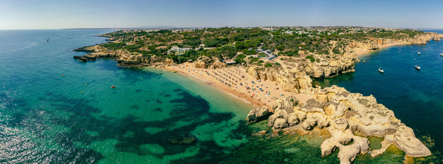 Naklejka premium Panoramic aerial drone view of Praia do Castelo beach, Albufeira, Algarve, Portugal