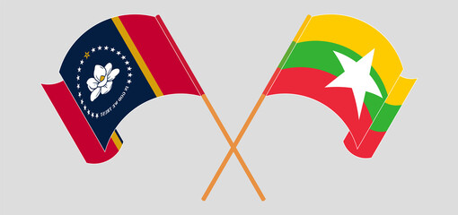 Crossed and waving flags of The State of Mississippi and Myanmar