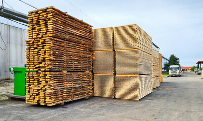 Unedged and edged boards in stacks. Finished goods warehouse