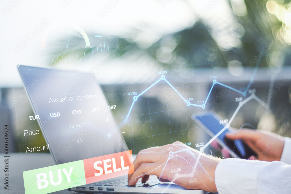 Poster Close up of hands using laptop and cellphone with forex chart and sell, buy buttons on blurry background. Stock exchange, cryptocurrency and global fund information concept. Double exposure.