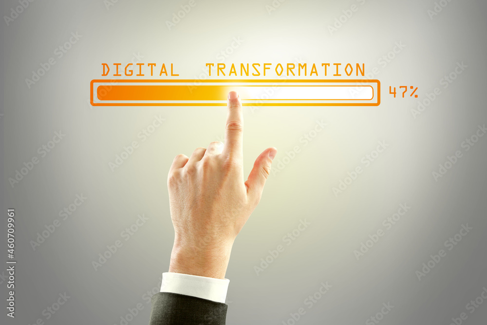 Aufkleber businessman hand pointing at abstract glowing loading bar on gray wall background. digital transform