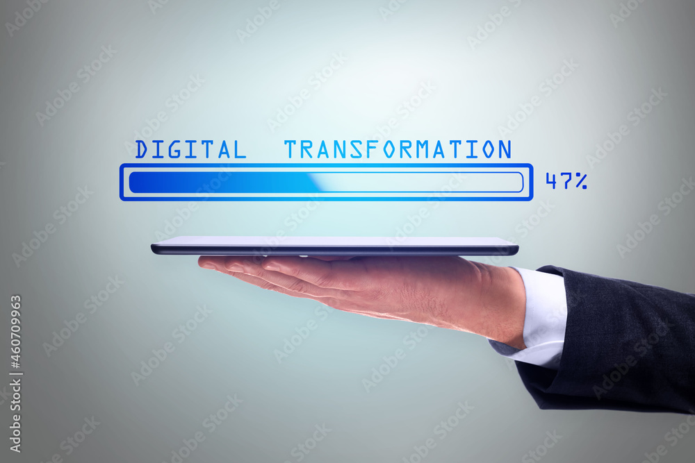 Poster Man hand holding tablet with abstract glowing loading bar on gray wall background. Digital transformation, internet, progress and technology concept.