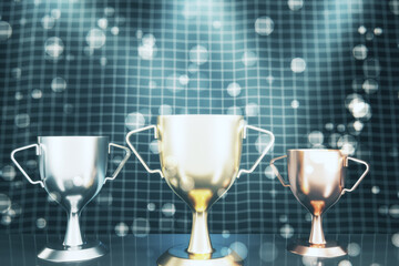Three winners cup on abstract bokeh grid background. Competition and win concept. 3D Rendering.