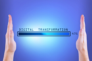 Man hands holding abstract glowing loading bar on blue wall background. Digital transformation, internet, progress and technology concept.