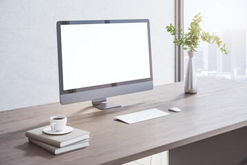 Close up of creative wooden designer desktop with blank white mock up computer monitor, coffee cup, other items, window with city view and daylight. 3D Rendering.
