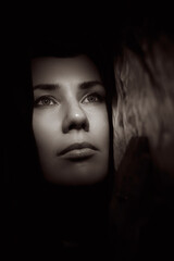 Portrait of a young woman in the shade close up