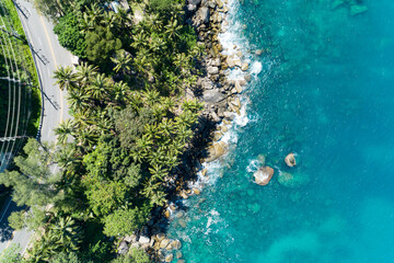Aerial view of curve road along the seashore at Phuket Thailand beautiful seacoast and open sea in summer season Nature recovered Environment and Travel background