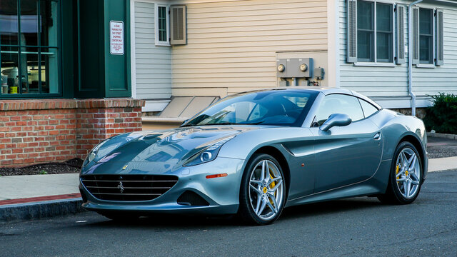 DARIEN, CT, USA - OCTOBER 2, 2021:  Ferrari parking on Grove street  upfront Butcher shop