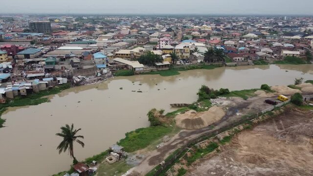 Lagos-Ibadan Expressway connecting Ogun State to Lagos State. This is Kara Bridge by Ojodu Berger and The famous big Nigeria Flagged Chineese Industry.