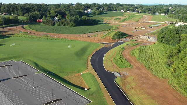 Aerial of new development with freshly paved street. Residential development in local American community.