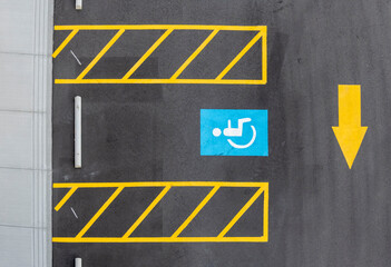 overhead view of handicap parking stall with directional arrow