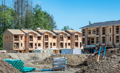 new townhome construction with excavated hole