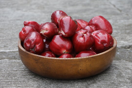 Pile of jambu or Rose apple also known as Syzygium Malaccense in a wooden bowl