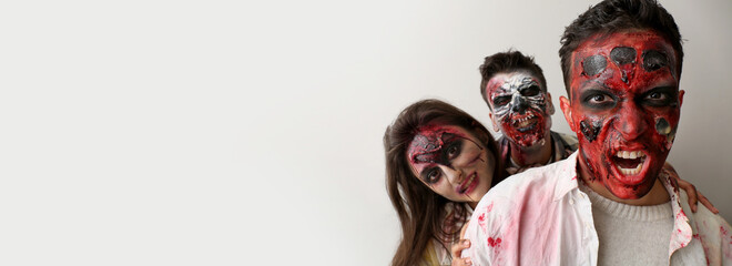 Scary zombies on light background with space for text