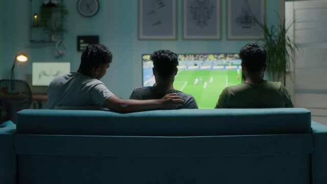 Indian men discussing football match