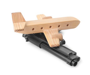 Wooden airplane and gun on white background. Concept of hostage
