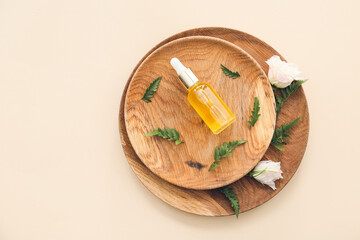 Bottle of healthy essential oil on light background