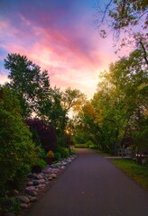 Sunrise Glowing Over A Fall Park Pathway