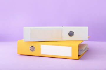 Office folders on color background