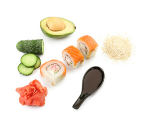 Delicious sushi rolls, ingredients and spoon with soy sauce on white background