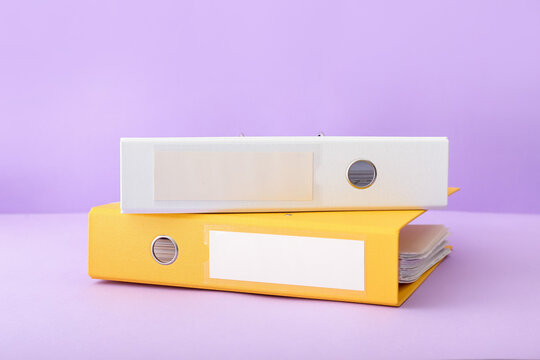 Office folders on color background