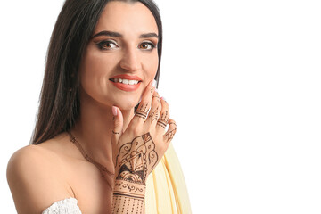 Beautiful Indian woman with henna tattoo on white background