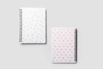 Stylish notebooks on grey background