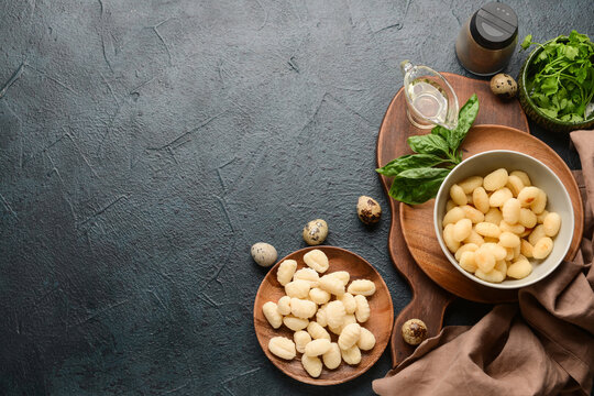 Composition with tasty gnocchi on dark background