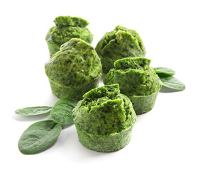 Tasty spinach muffins on white background