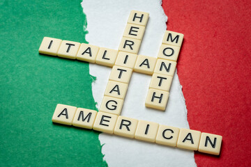 October - National Italian American Heritage Month, crossword against paper abstract in colors of...