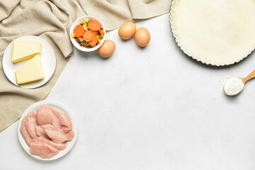 Raw dough and ingredients on white background