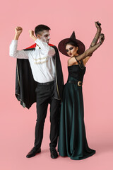 People in Halloween costumes on color background