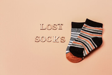 Day lost socks, lonely socks on a beige background.
