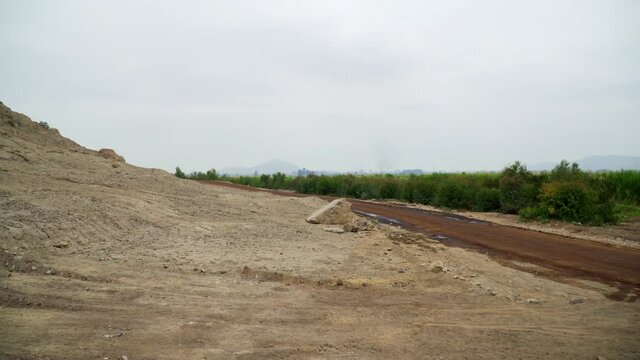 Trash and Rubbish in the dry landscape along the roadside on the Northern coast of Peru, South America. Facala, Ascope, La Libertad
