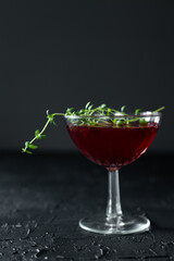 One blackberry and thyme mimosa in a vintage, crystal, champagne saucer 