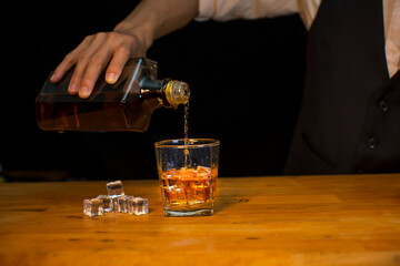 Bartender Serve Whiskey, on wood bar, 