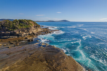 Morning seascape flight over The Skillion at Terrigal