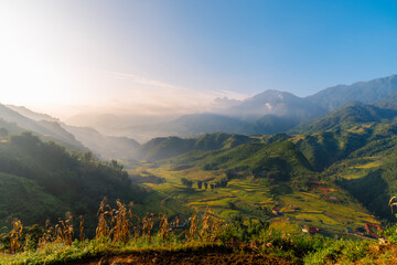Beautiful Mountain landscape foggy windy mountain range green landscape asian farm. Amazing Landscape mountain green field meadow white cloud blue sky on sunrise. Countryside sunlight heaven scenery