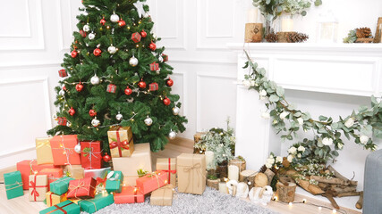 Christmas tree decorated holiday winter xmas celebration present gift to family decorate with ornament golden ball in cozy living room. Merry Christmas and happy new year festival traditional concept.